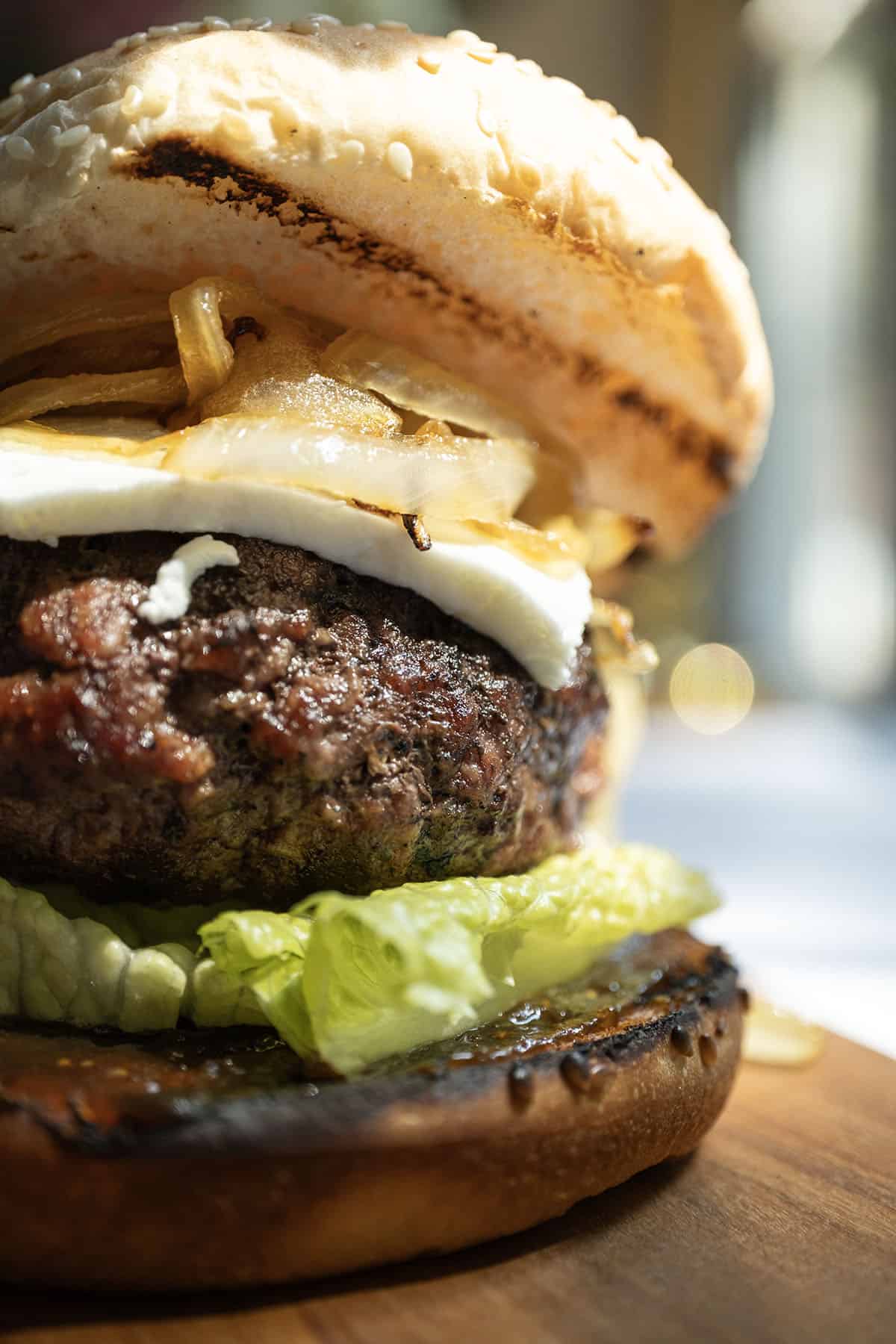 Gourmet Fig and Goat Cheese Burger 8 Burger on lettuce and fig jam topped with goat cheese and onions.