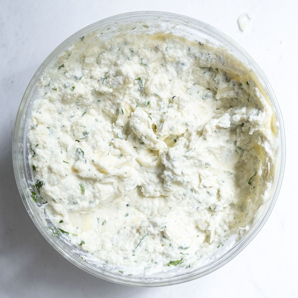 Ricotta combined with eggs, cheese, and herbs.