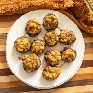 Italian sausage stuffed mushrooms on a plate.