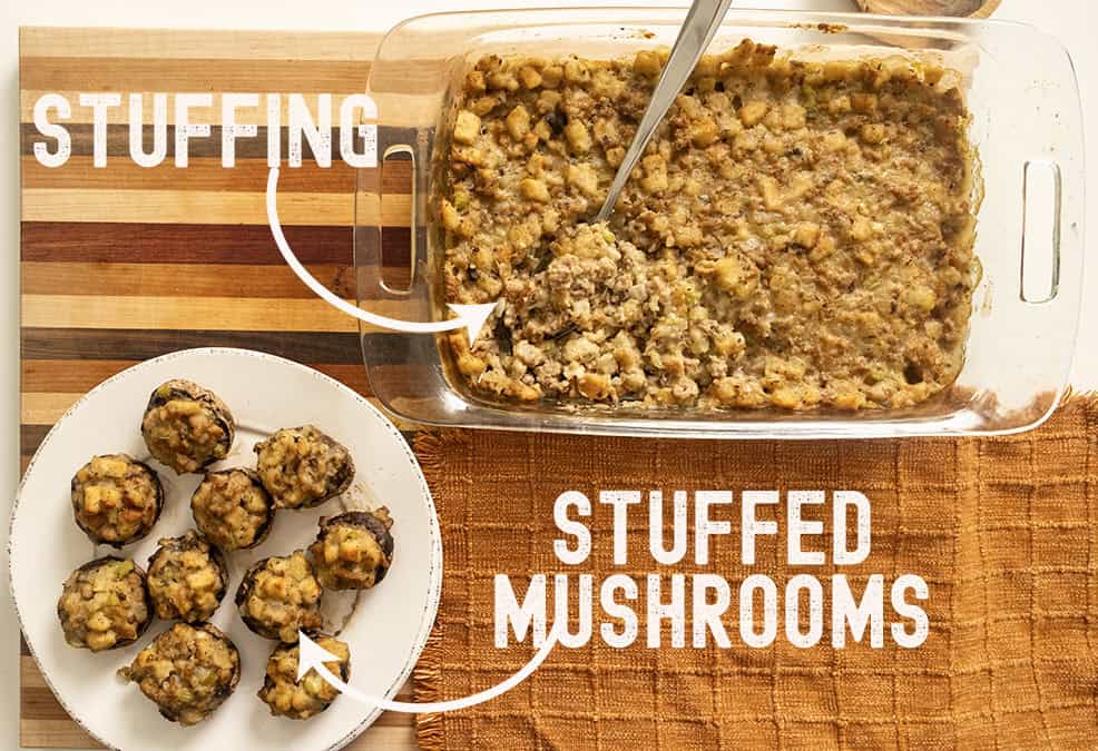 Stuffing and stuffed mushrooms plated on a cutting board.
