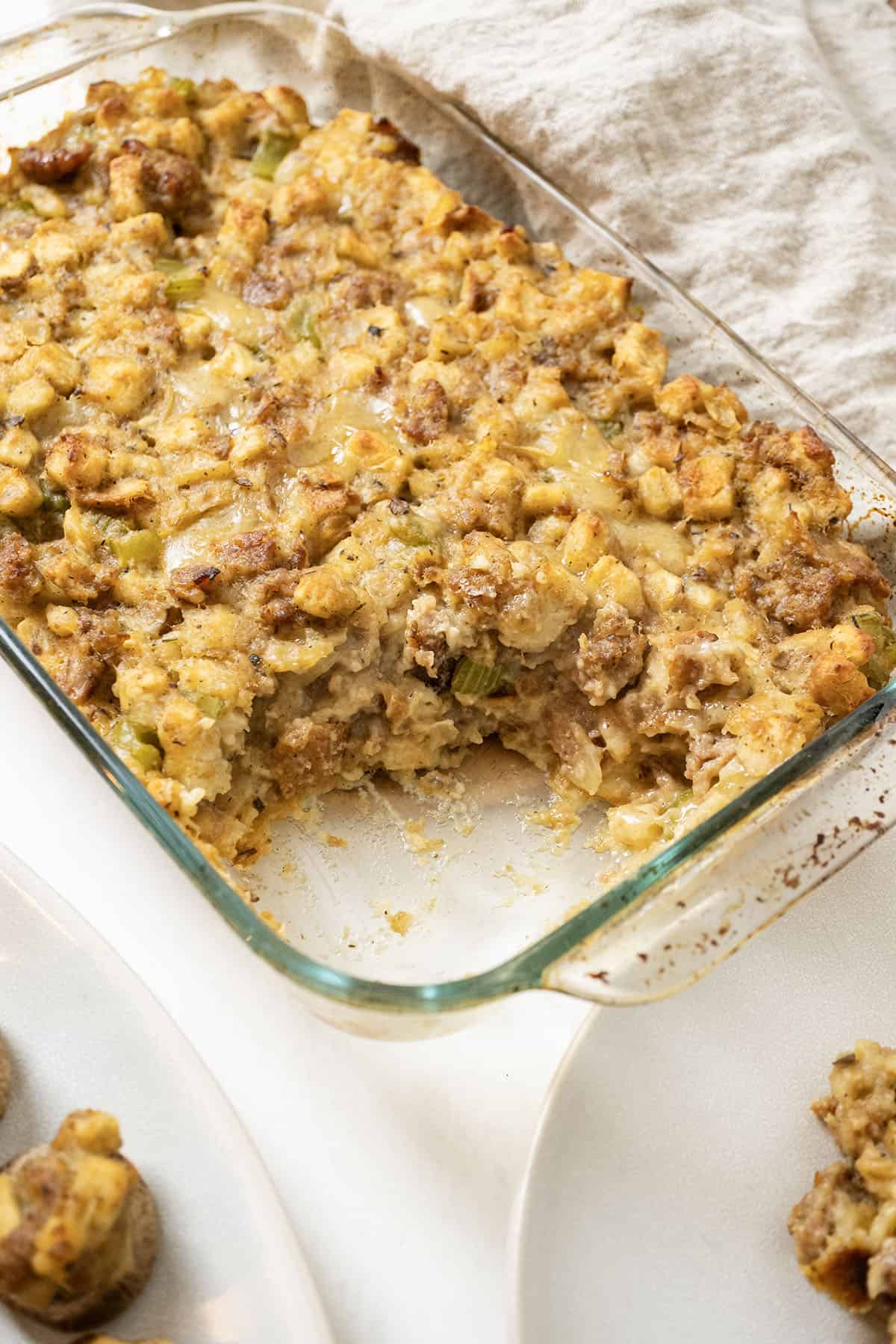 Italian sausage stuffing baked in a glass baking pan.