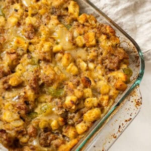 Italian sausage stuffing baked in a glass baking pan.