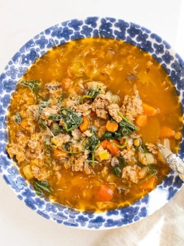 Bowl of sausage and lentil soup.