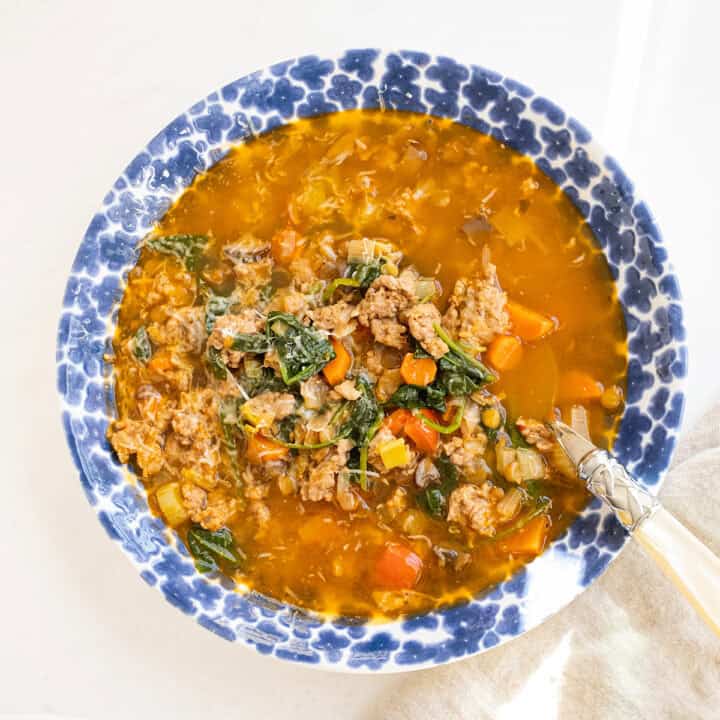 Bowl of sausage and lentil soup.