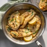 Chicken piccata in a saucepan.