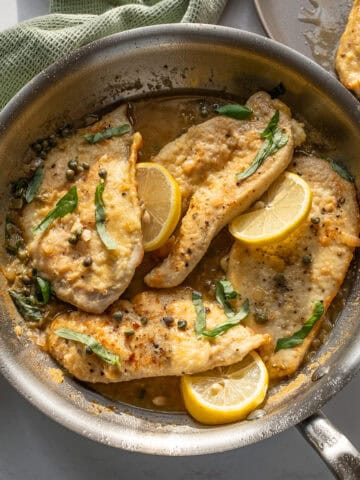 Chicken piccata in a saucepan.