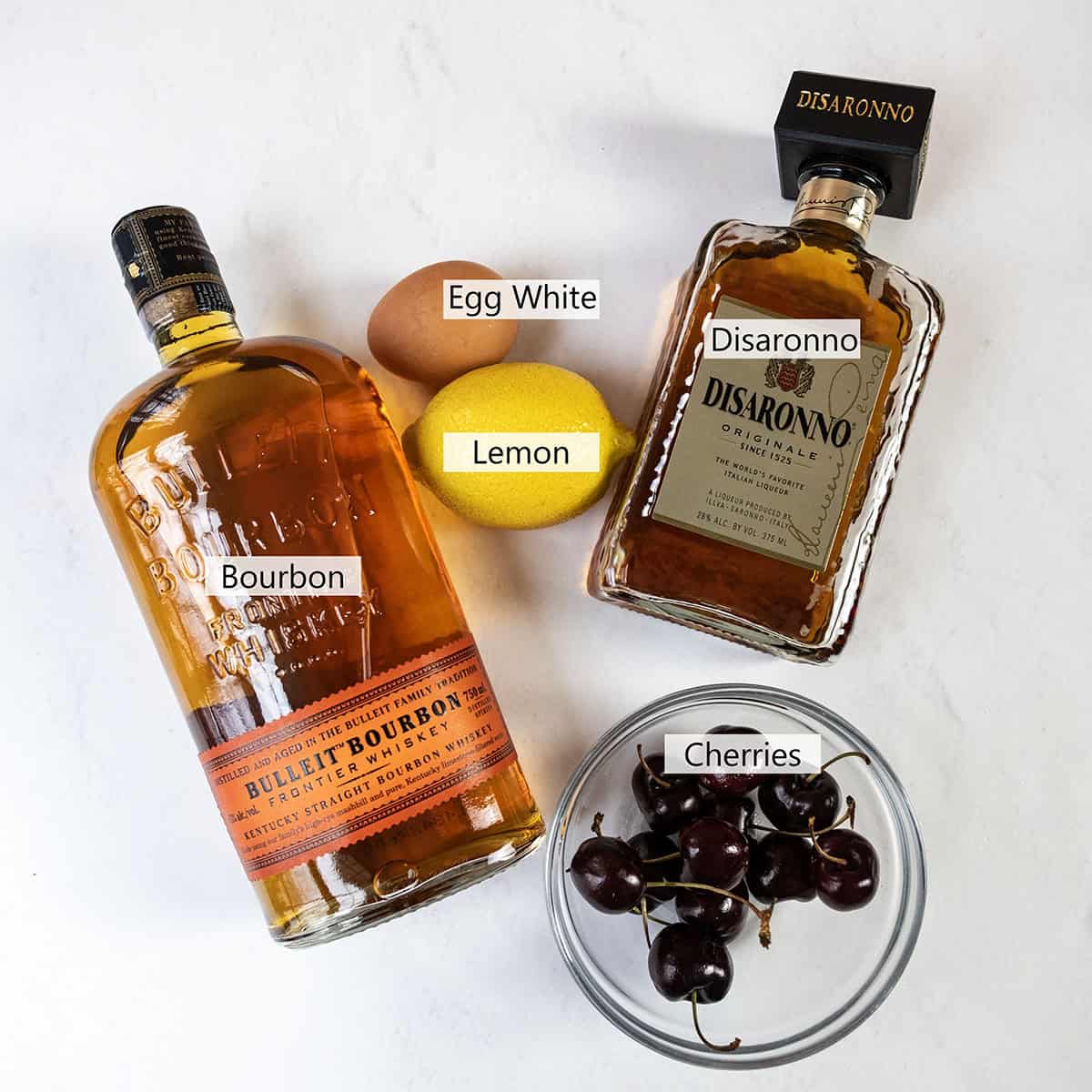 Ingredients for a cherry amaretto sour.