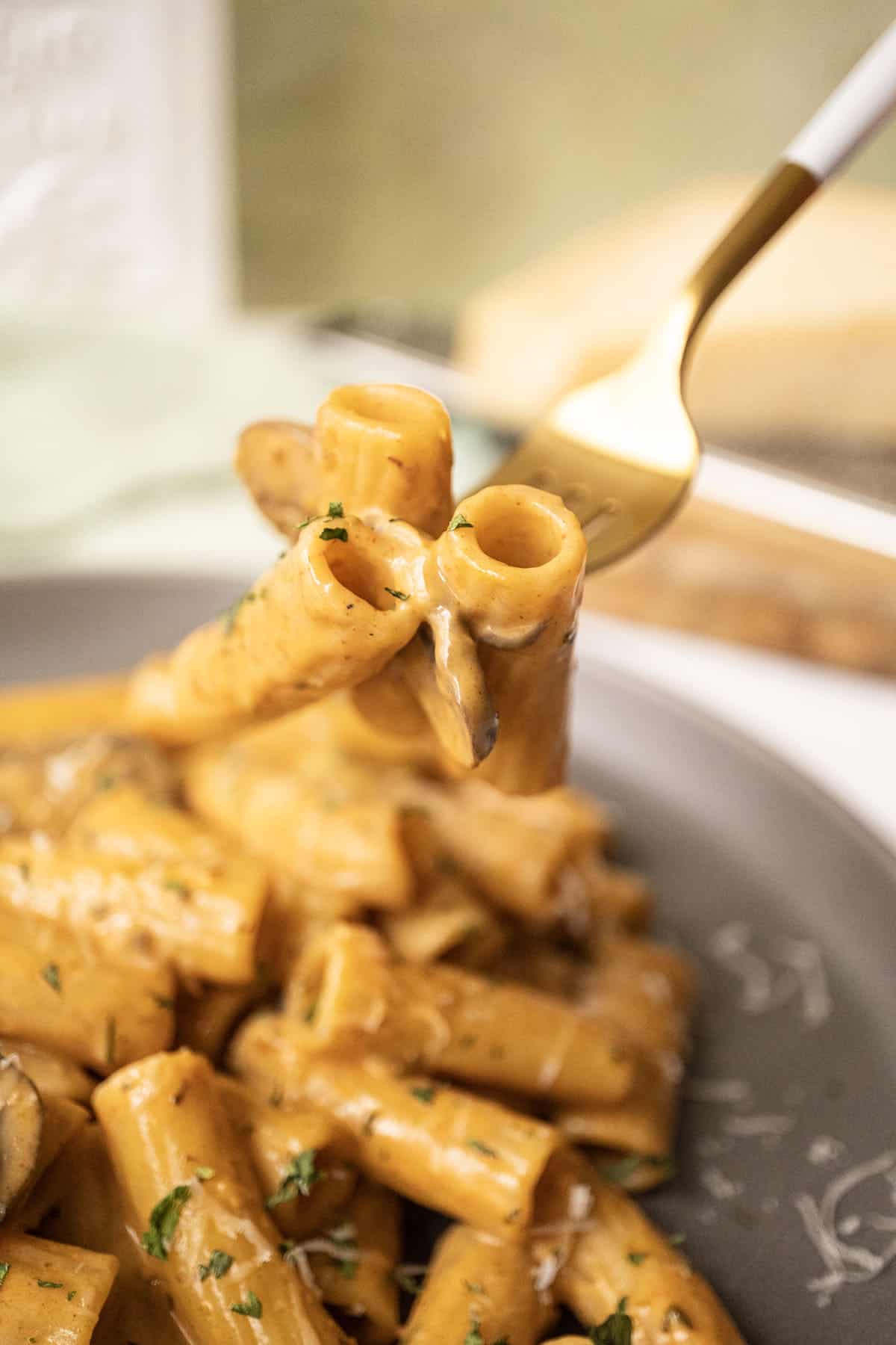 Velvety Garlic Mushroom Pasta 11 Creamy mushroom pasta on a fork.