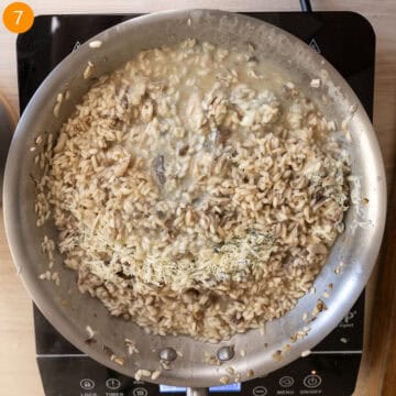 Tossing risotto with gorgonzola and butter.