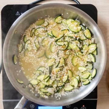 White wine simmering with arborio rice.