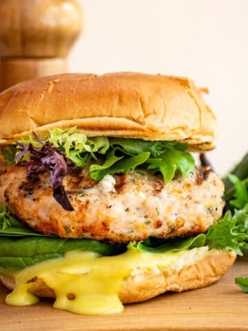 Grilled chicken burger on a bun with garlic aioli.