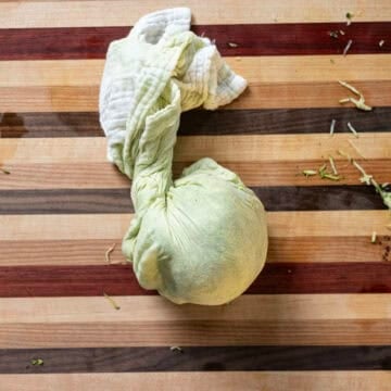 Grated zucchini in a cheese cloth. 