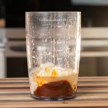 Chipotle mayo ingredients combined in a mixing cup. 