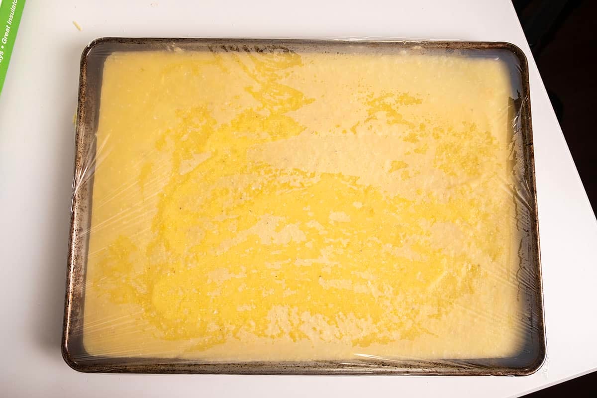 Polenta chilled on a baking sheet.