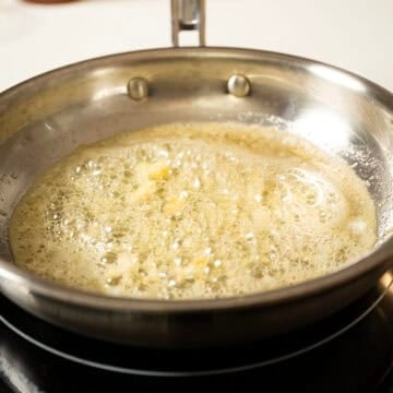 Sauteing garlic in butter.