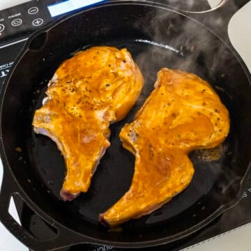 Glazing pork chops in a cast iron.
