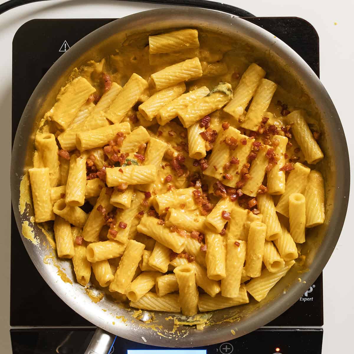 Pumpkin pasta tossed with pancetta. 