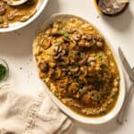 Veal marsala topped with mushrooms over risotto.