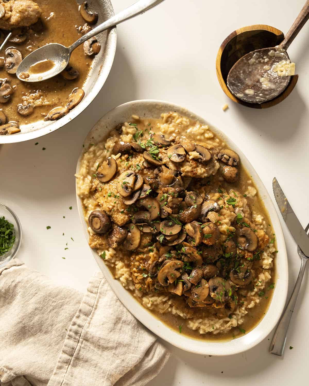 Veal marsala topped with mushrooms over risotto. 