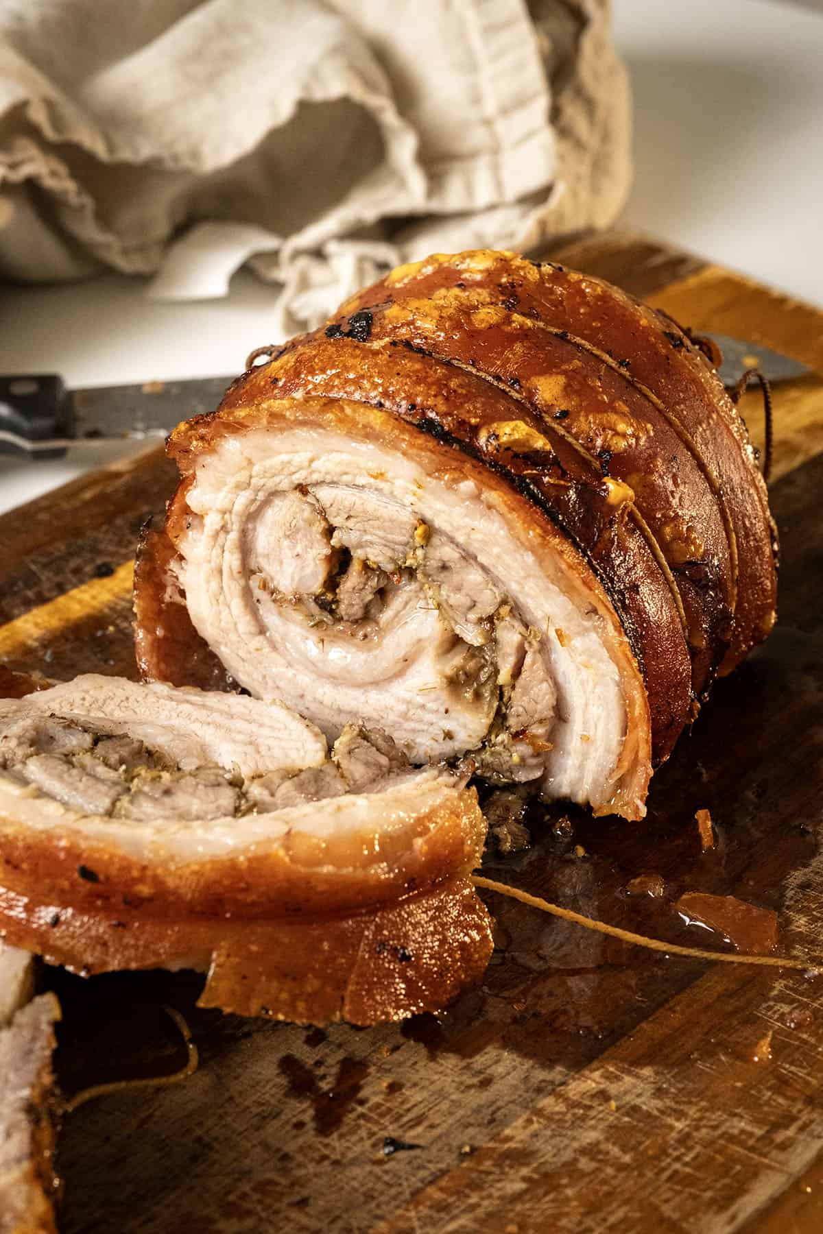 Authentic Italian Porchetta on a cutting board.
