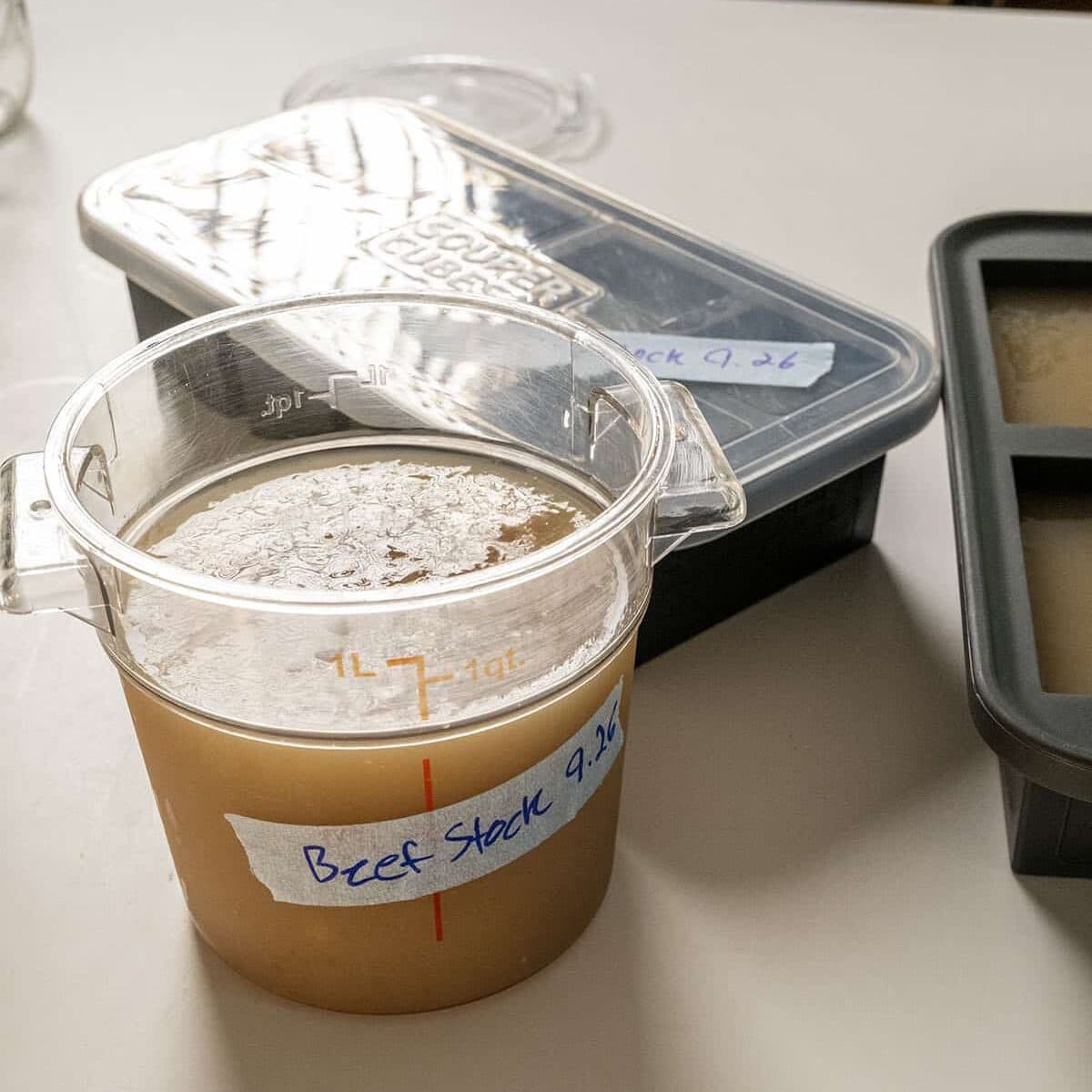 Beef stock in a container.