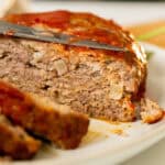Italian meatloaf sliced on a plate.
