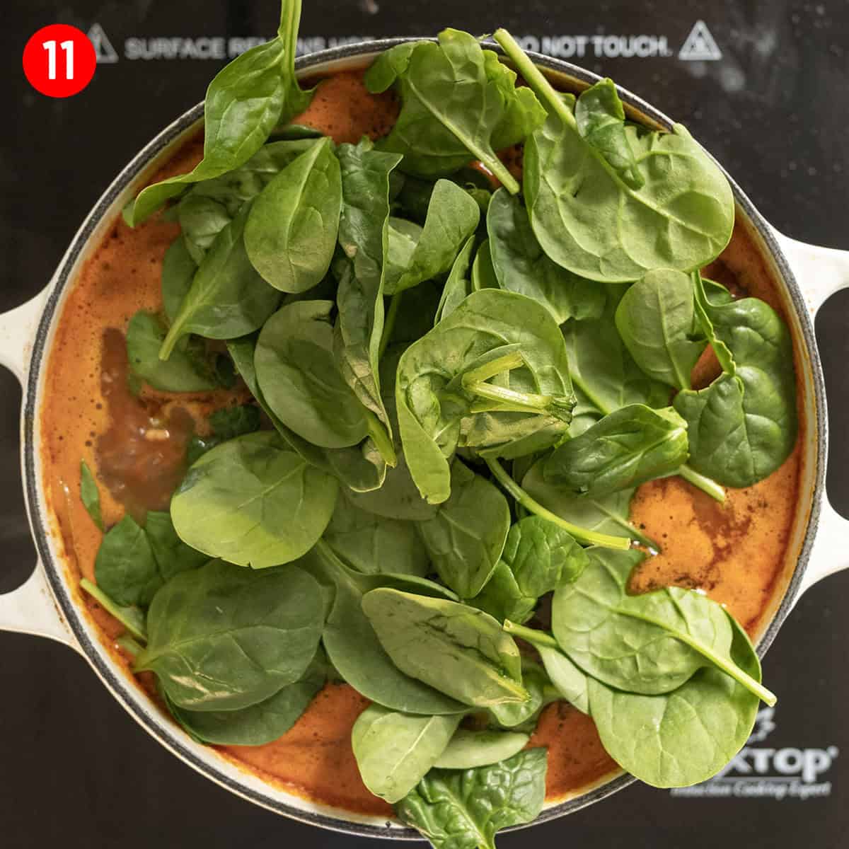 Wilting spinach in soup.
