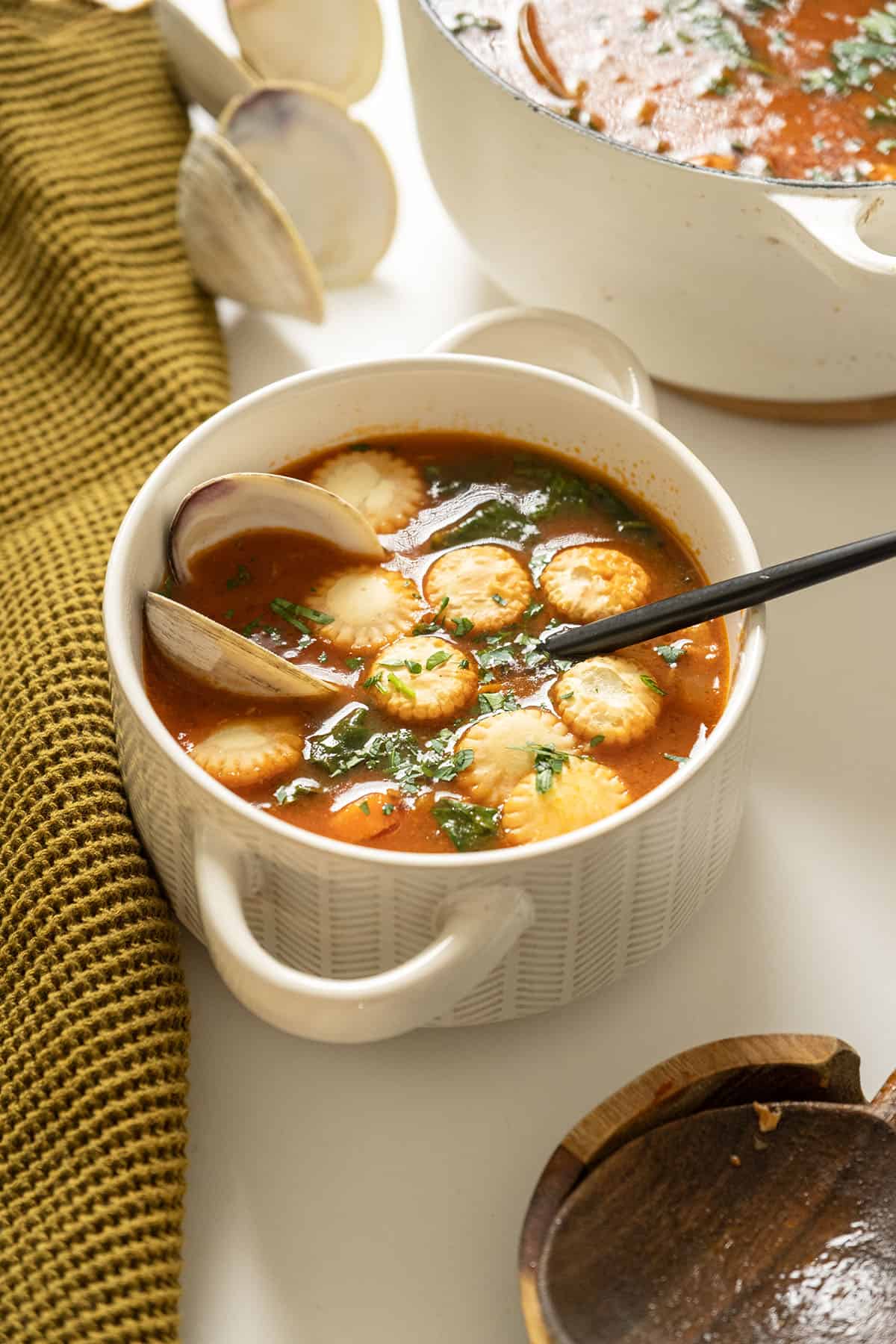 Manhattan clam chowder topped with oyster crackers. 