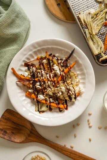 Roasted Carrots and fennel topped with pine nuts and balsamic glaze.