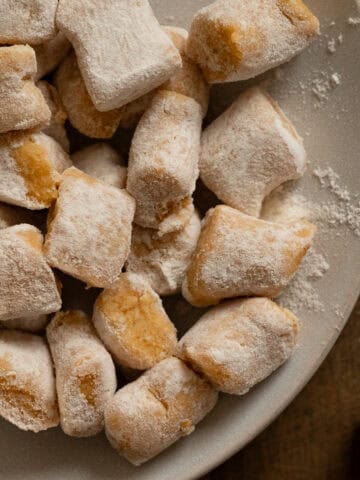 Homemade pumpkin gnocchi on a plate.