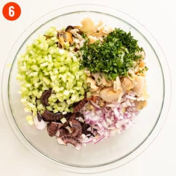 Combing salad ingredients in a bowl.