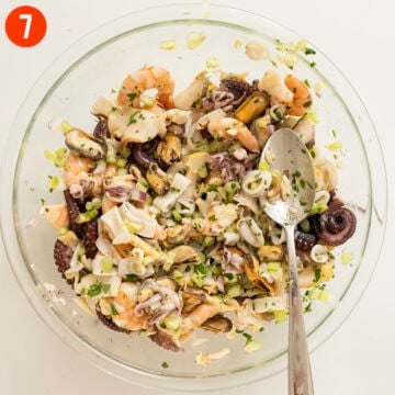 Seafood salad combined in a bowl.