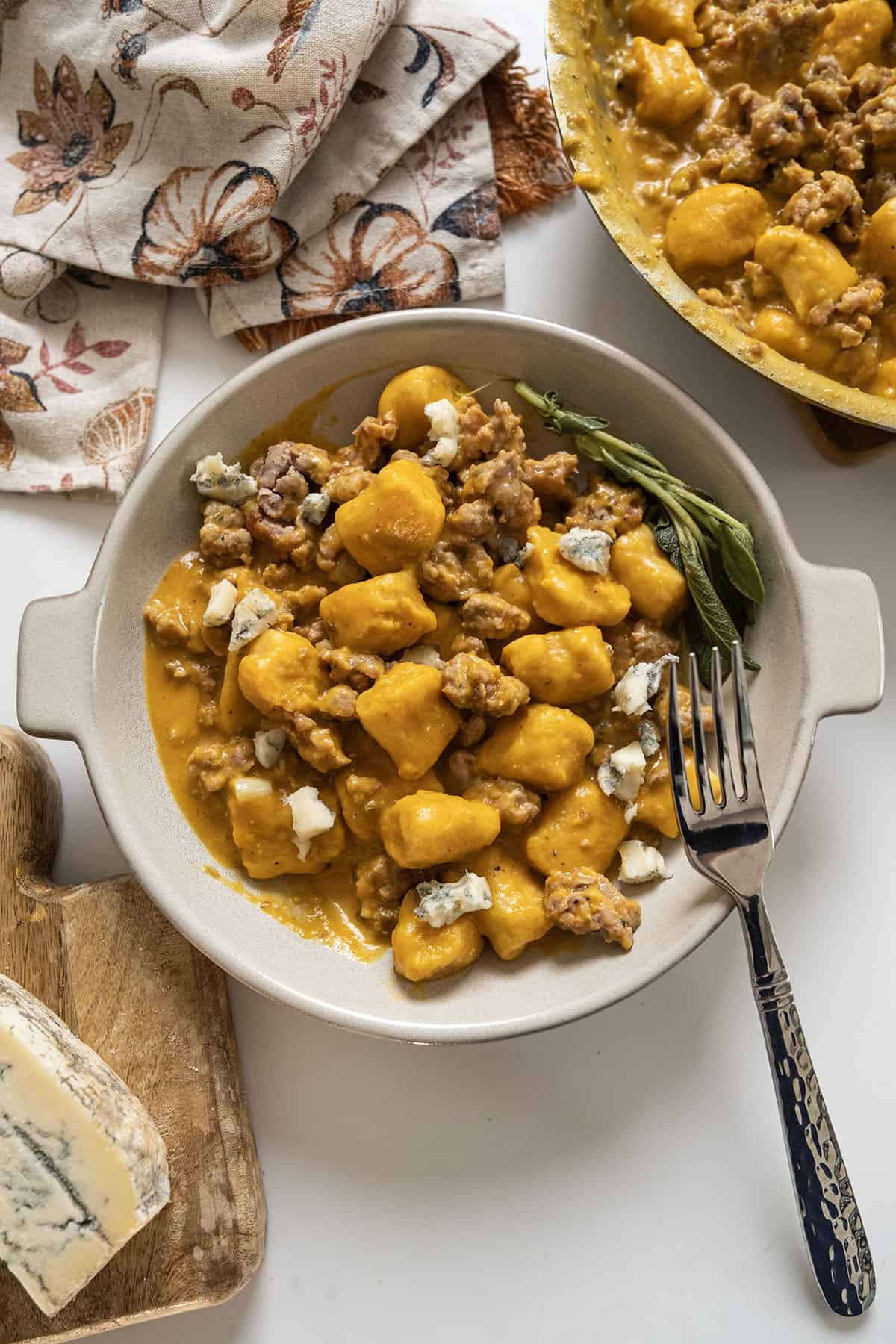 Gnocchi with pumpkin sauce and sausage.