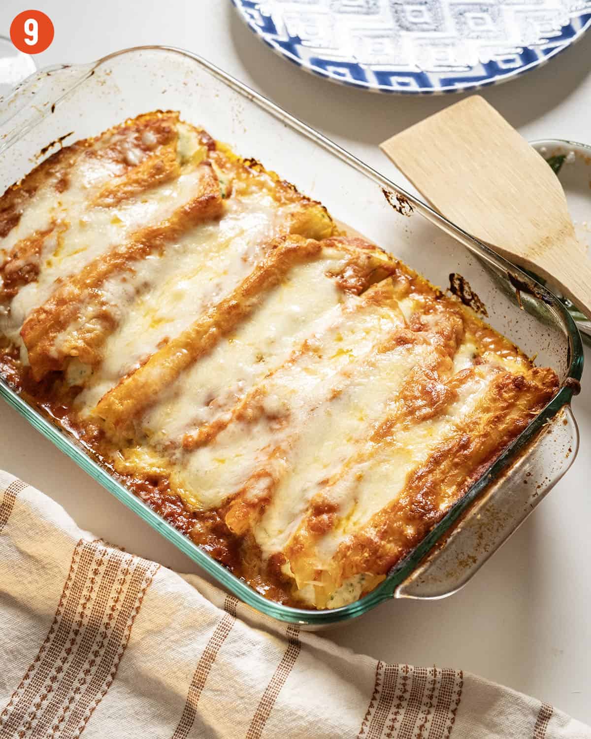 Baked manicotti topped with smooth marinara and mozzarella.