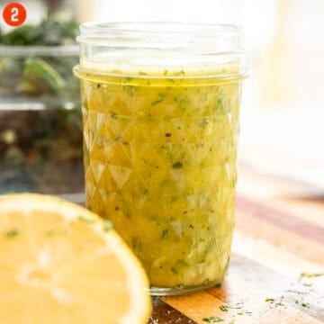 Lemon parsley dressing in a mason jar.
