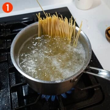 Boiling spaghetti in salted water.