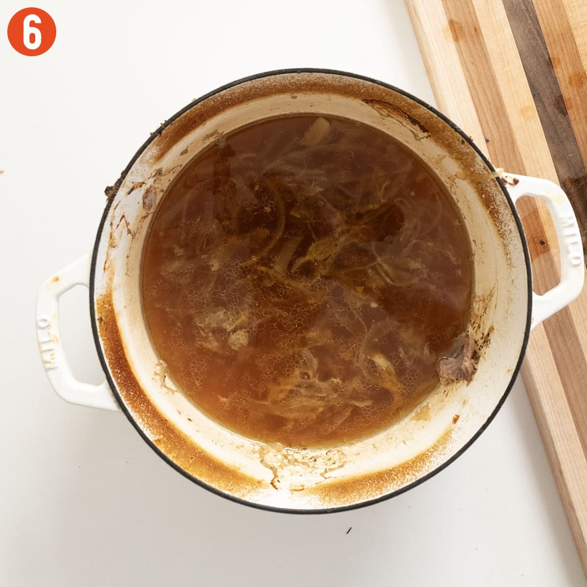 Pork Au Jus in the dutch oven after removing pork.