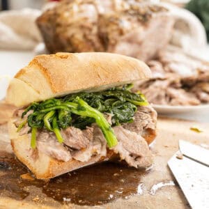 Italian pork sandwich with roast pork shoulder, broccoli rabe, and provolone.
