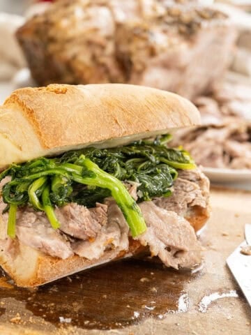 Italian pork sandwich with roast pork shoulder, broccoli rabe, and provolone.