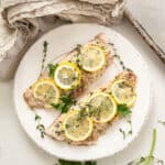 Baked red snapper topped with lemon and thyme.