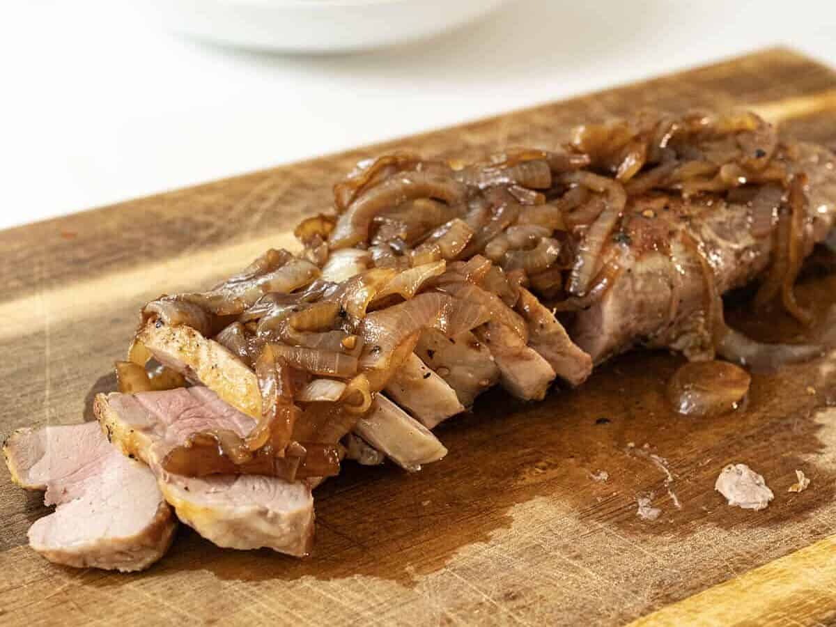 Balsamic onions topping a pork tenderloin roast.