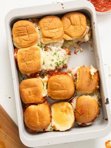 Chicken parm sliders in a tray.