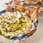 Homemade cannoli dip and chips in a dish.