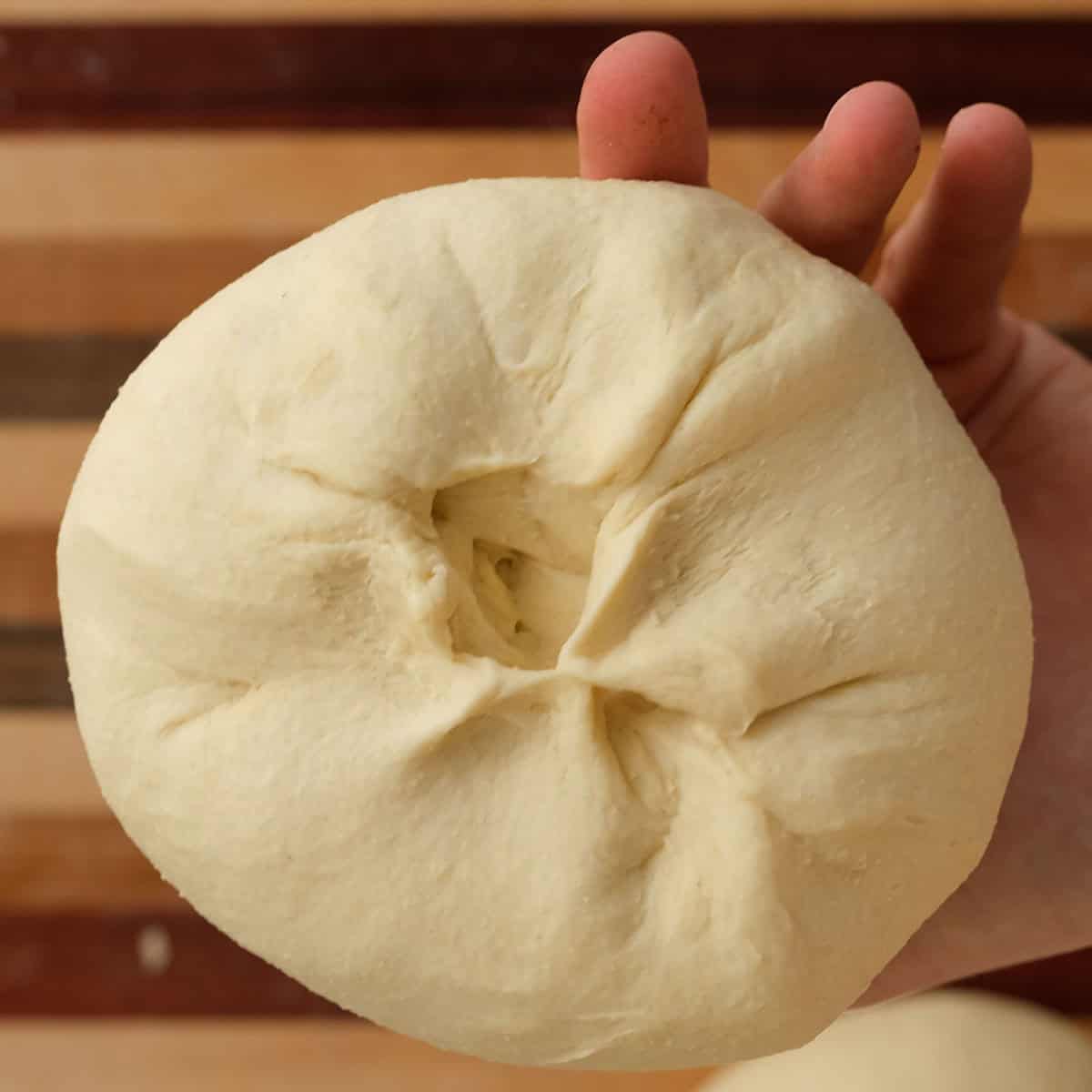 Pinching dough closed after splitting.