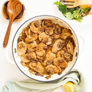 Pork tenderloin medallions in marsala sauce in a braiser.