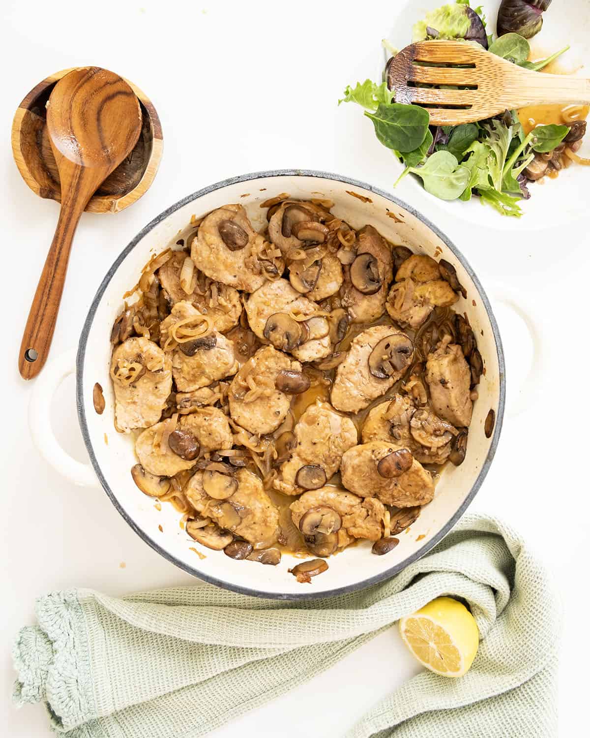 Pork tenderloin medallions in marsala sauce in a braiser.