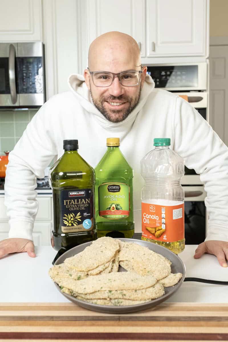 Me standing with 3 oils and chicken cutlets.