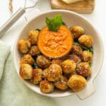 Polpette di Melanzane or eggplant meatballs in a bowl with sauce.