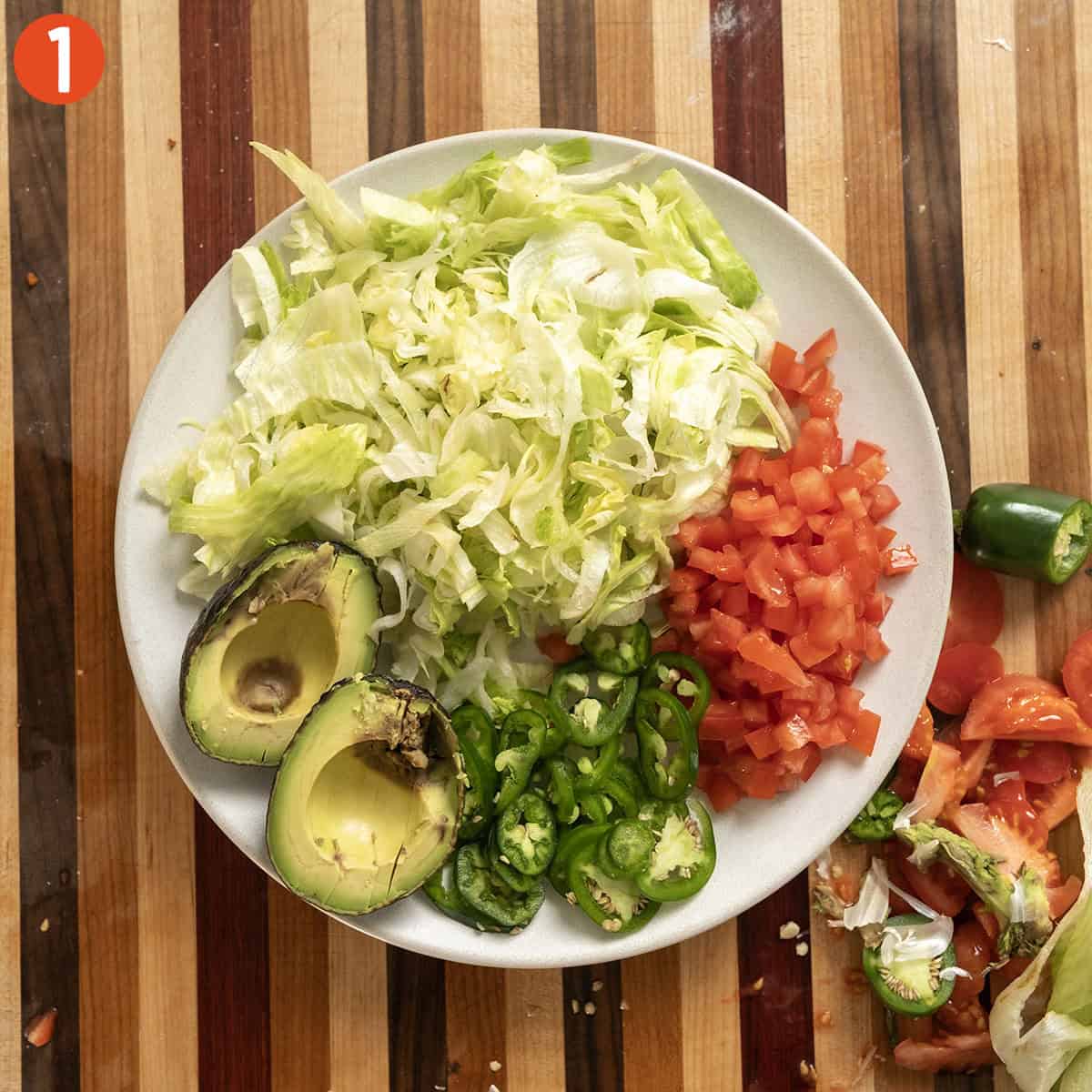 All taco toppings on a plate.