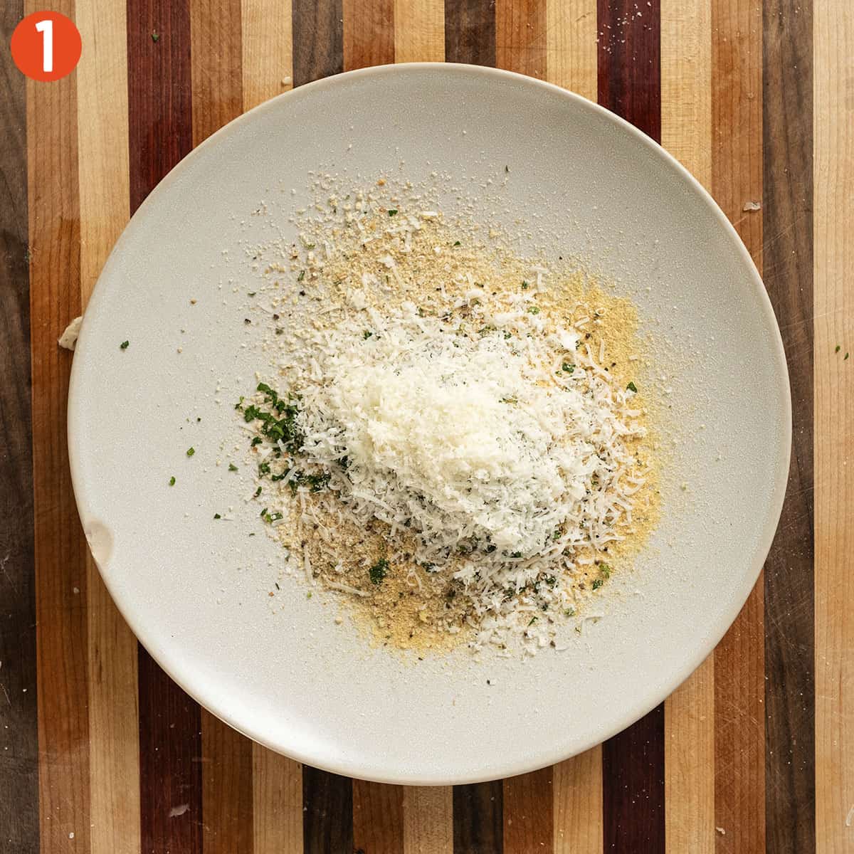 Breadcrumb mixture on a plate.